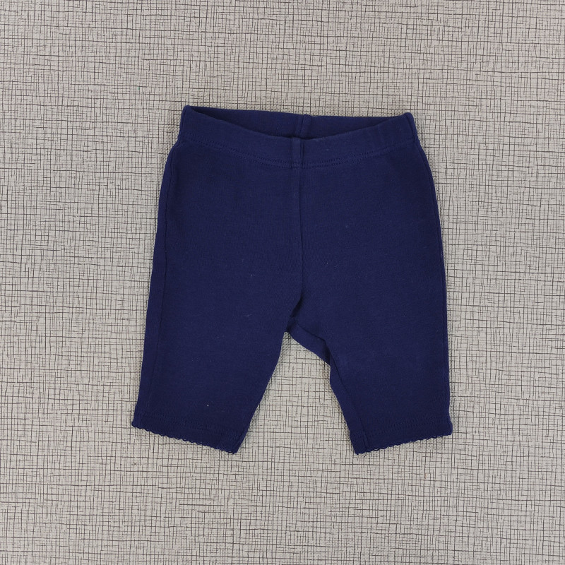 Pantalón  azul oscuro con decoración en los tobillos